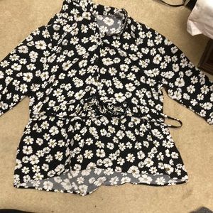A black blouse with white flowers